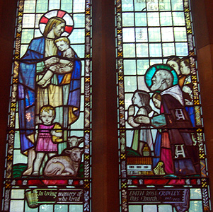 Western stained glass window in the north side of the nave September 2012
